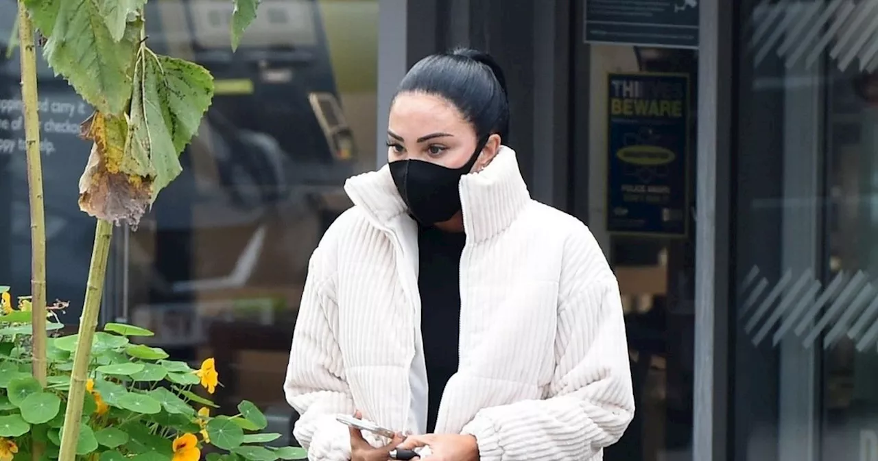 Tulisa wears surgical mask after showing off very swollen tattooed lips