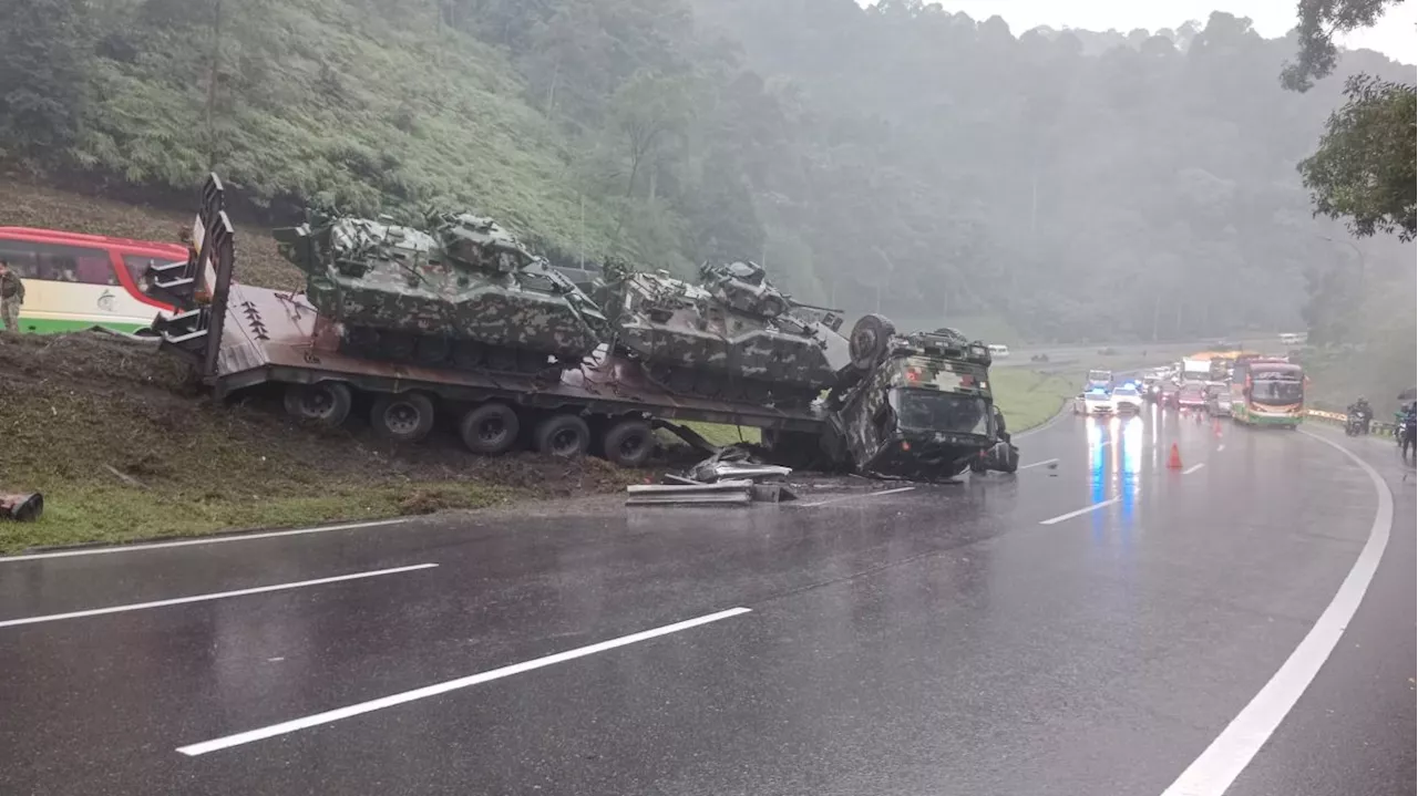 Driver of overturned Army transporter tried to avoid trailer that suddenly changed lanes