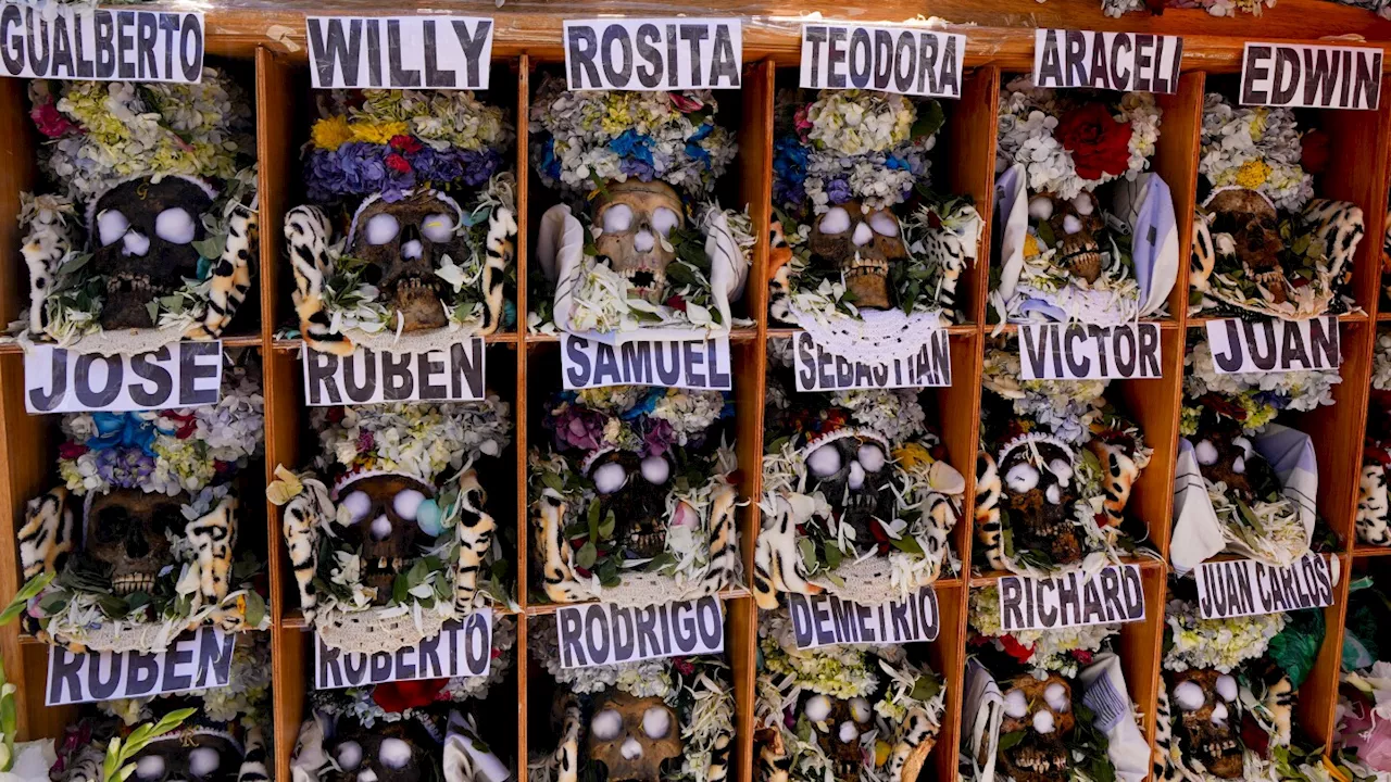 Bolivians carry adorned human skulls asking for favors in the Ñatitas festival in La Paz