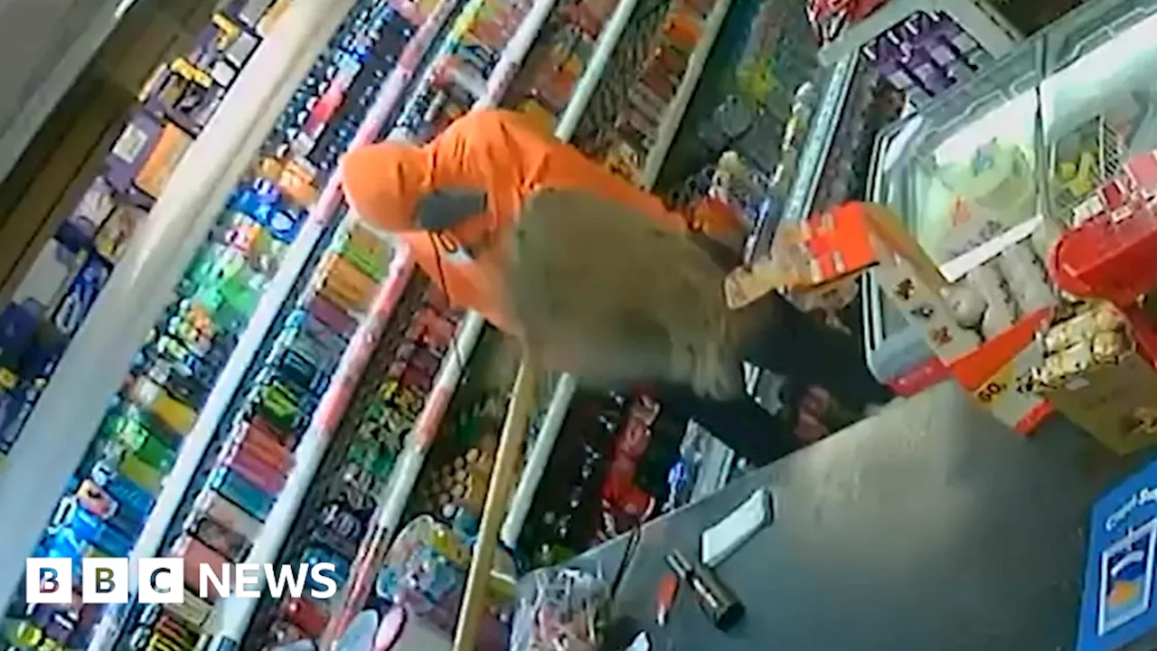 Appeal after shopkeeper fights off armed robber with mop