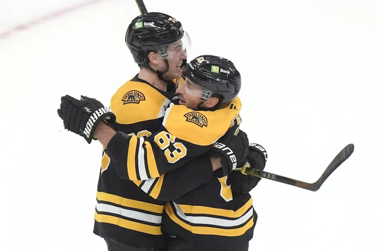 Brad Marchand scores OT goal to lead Bruins to 4-3 victory over Flames