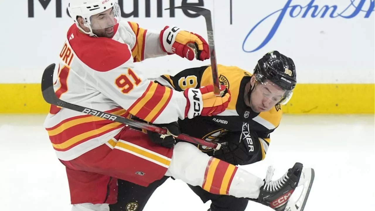 Brad Marchand scores OT goal to lead Bruins to 4-3 victory over Flames