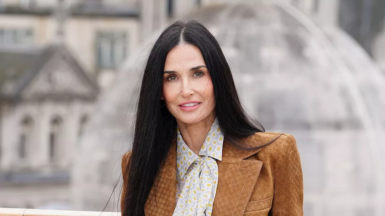 Demi Moore, 61, shows off her ageless complexion as she joins her on-screen husband Jon Hamm at a...