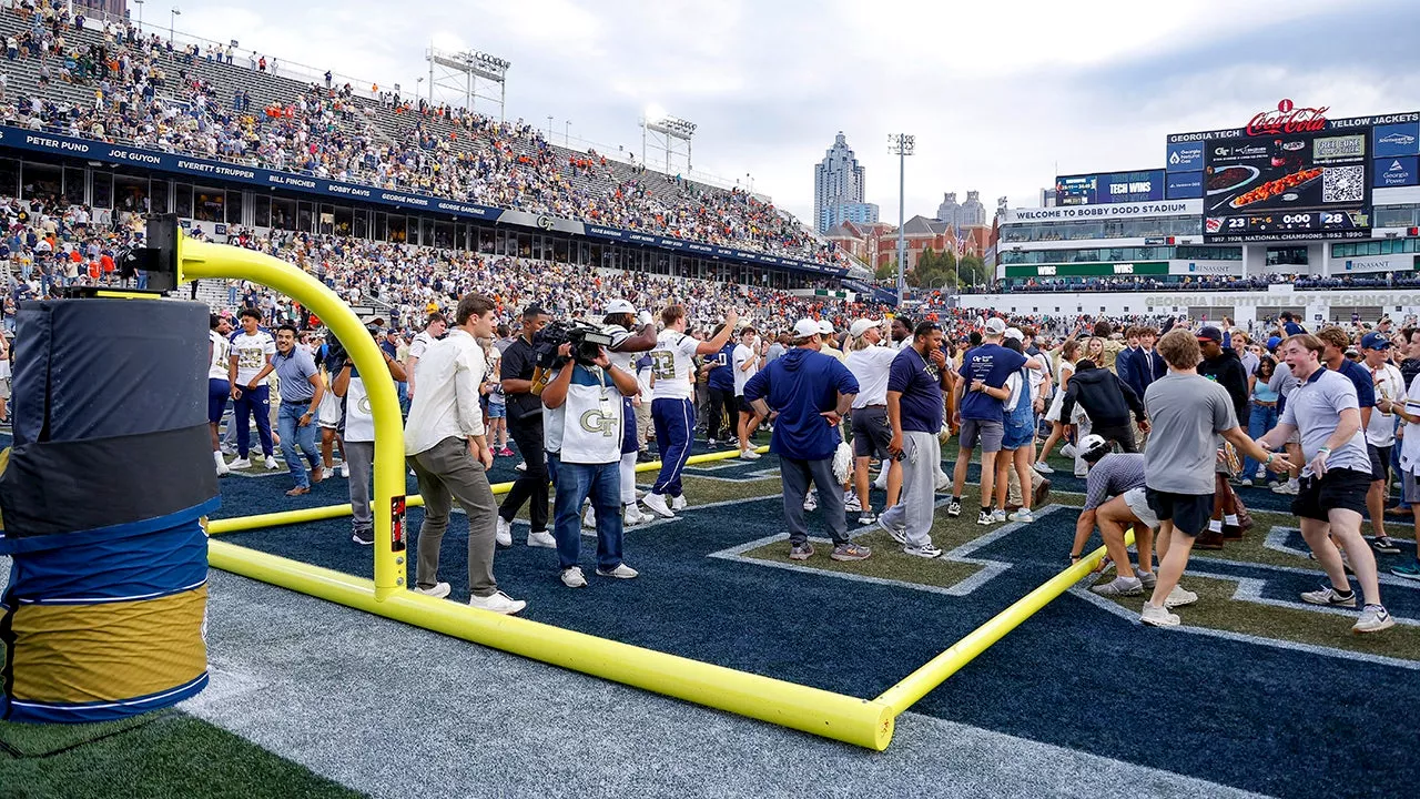 Fans topple goal posts after Georgia Tech upsets fourth-ranked Miami in ACC thriller