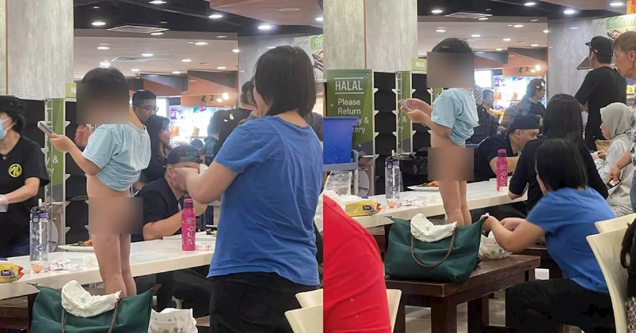 Woman Cleans Child’s Bottom in Singapore Food Court