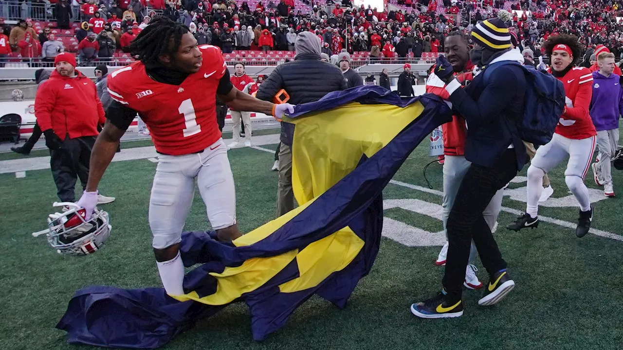 Michigan legend who saved Wolverines flag during wild brawl identified as nine-year NFL veteran...