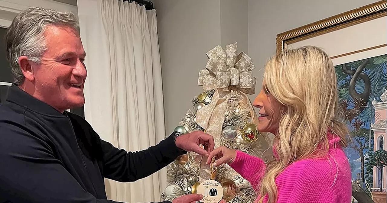 Joan and Chock Decorate Tree With Golden Bachelorette Ornament