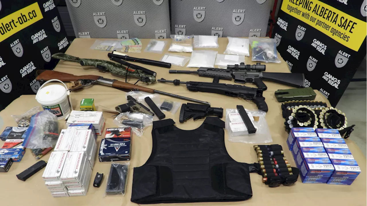 Charges laid after drugs, weapons seized from multiple southern Alberta homes