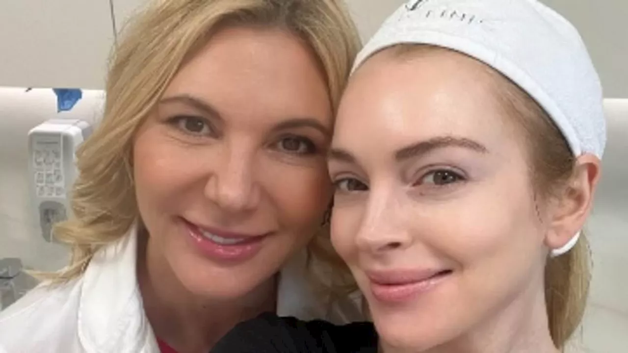 Lindsay Lohan shares selfie with anti-aging doctor after her rumored $300K plastic surgery glow-up