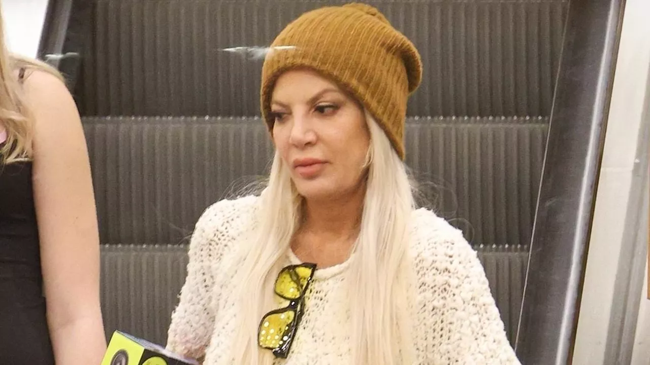 Tori Spelling looks glum Christmas shopping with kids after admitting to 'mom guilt' as a single...