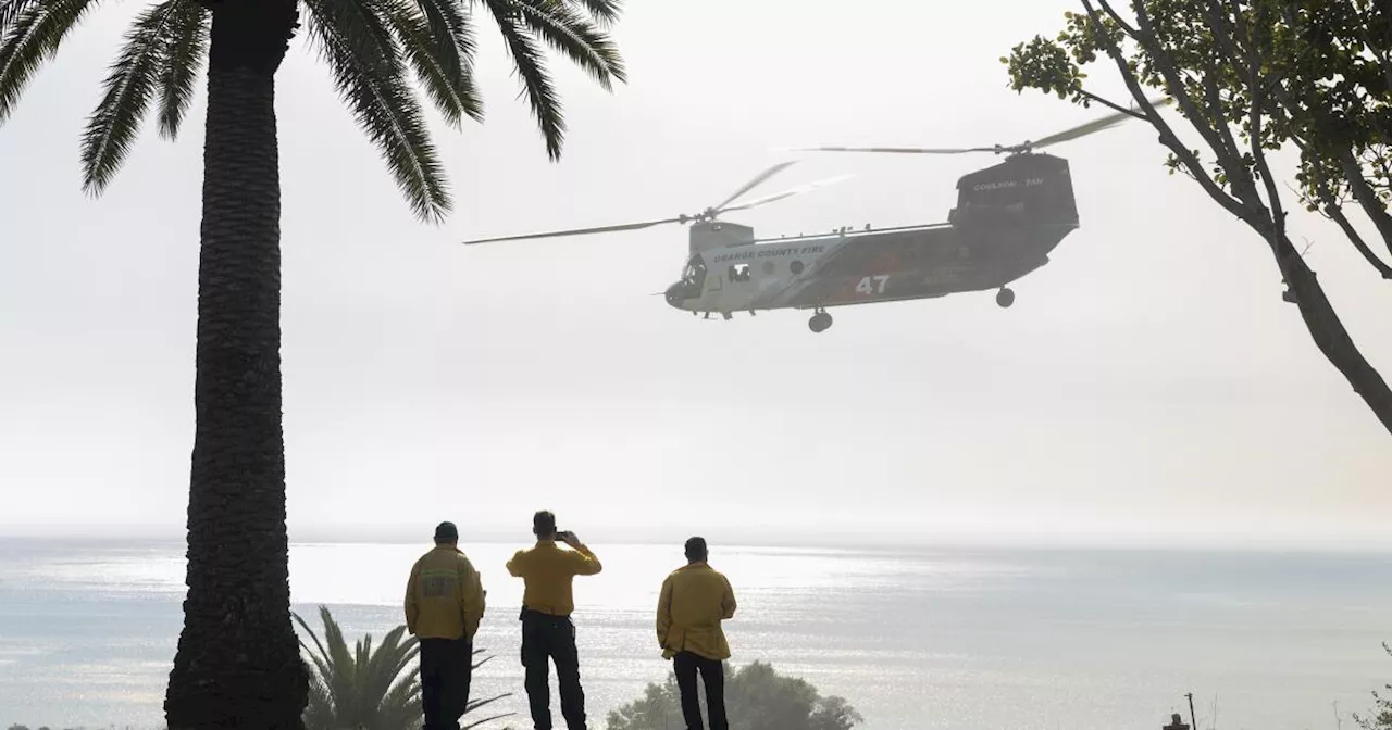 Raging Malibu fire burned to the Pacific Ocean but spared some hillside homes