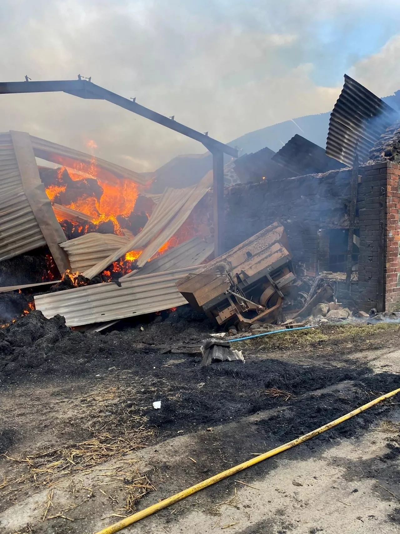 In photos: Welsh and English fire crews work together to battle barn fire near Welshpool