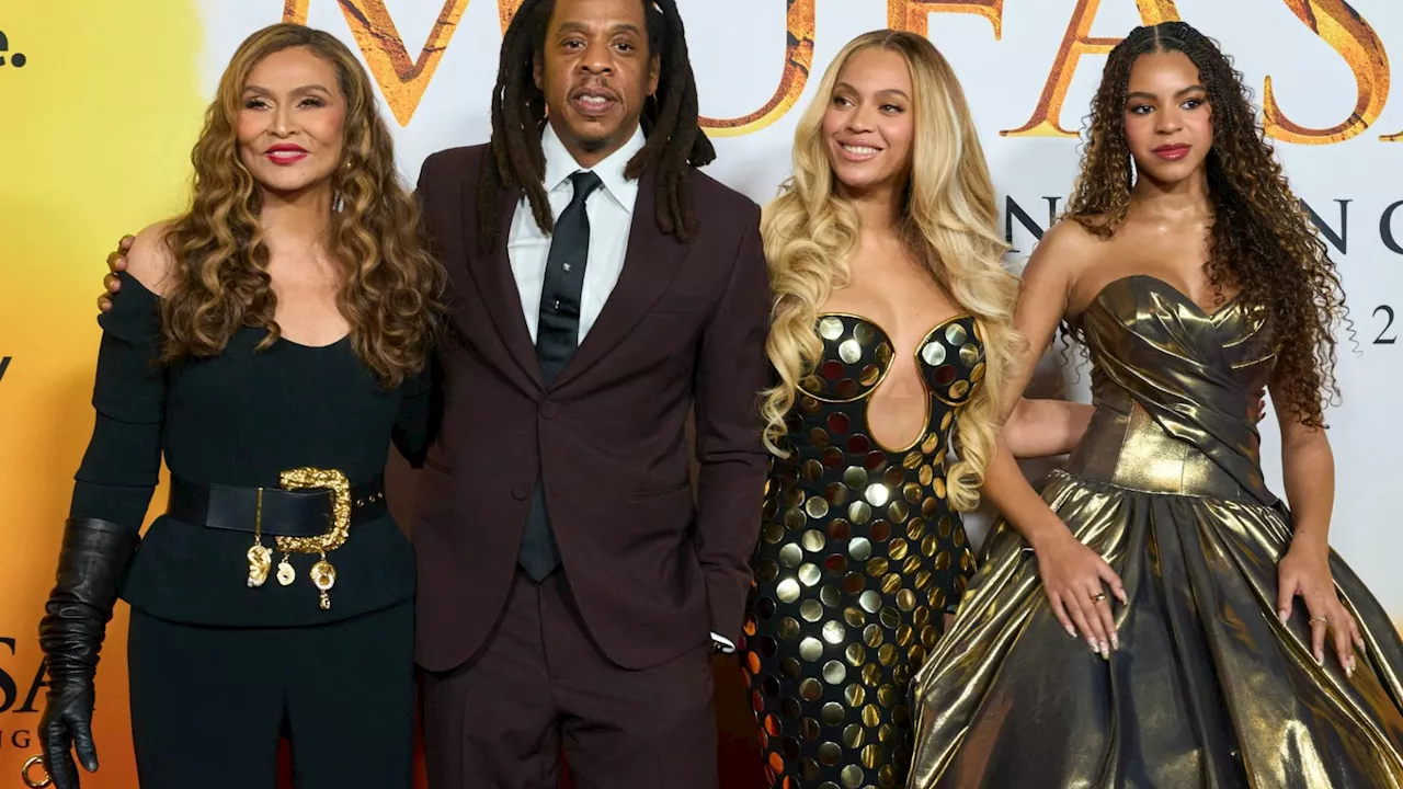 Jay-Z & Beyoncé put on united front at premiere with Blue Ivy after rapper accused of raping girl, 13, in...