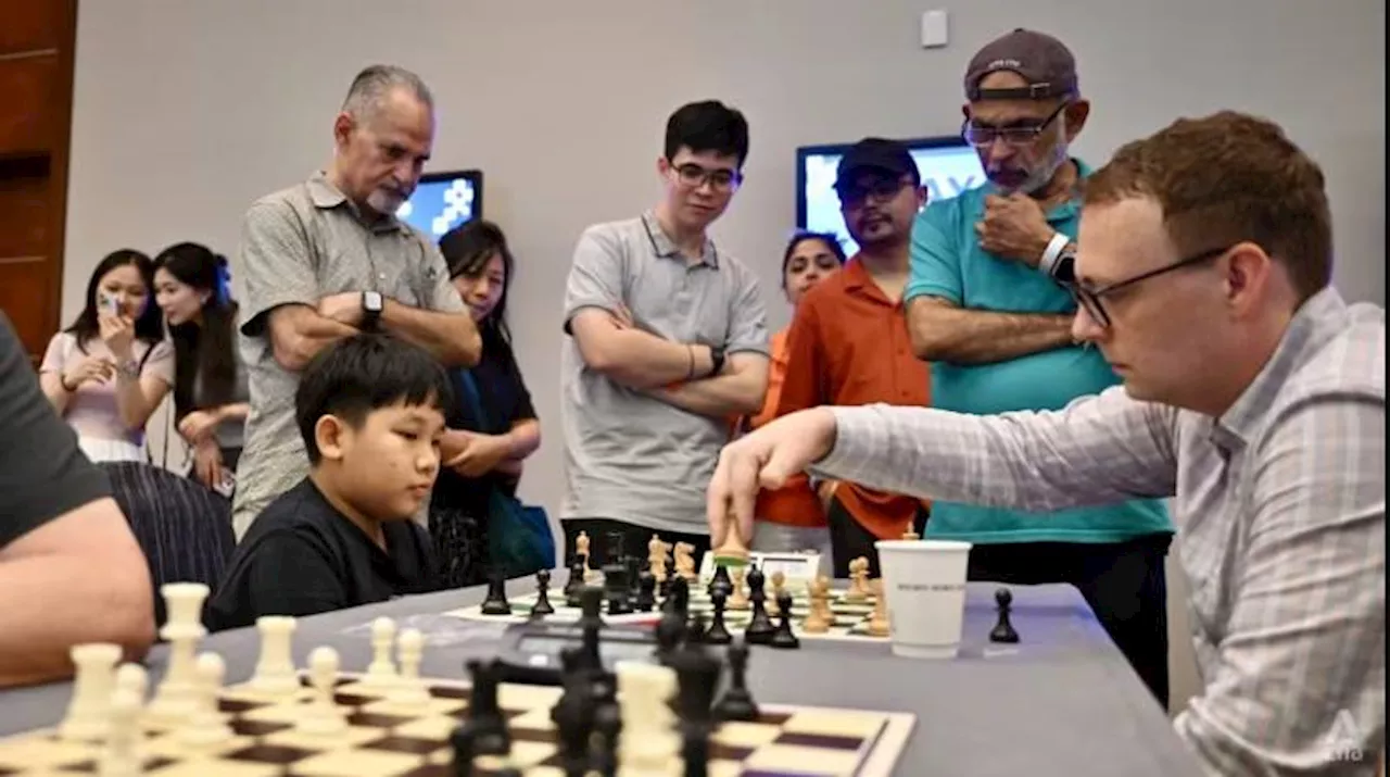 Chess fans celebrate 'once-in-a-lifetime' showdown in Singapore