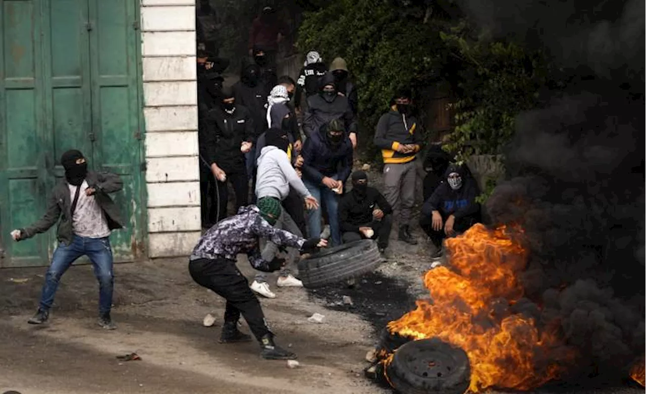 Tensions flare at funeral in West Bank after clashes