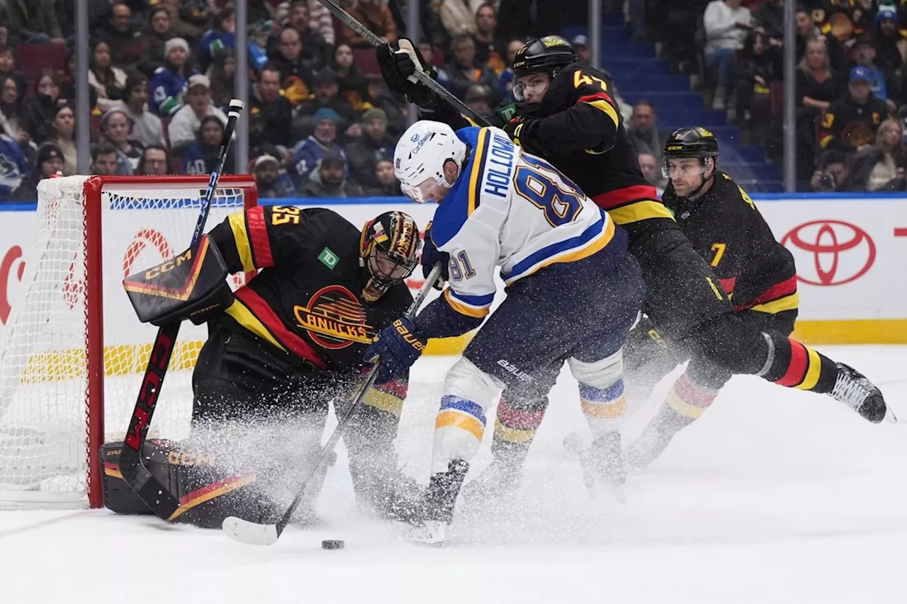 Holloway plays overtime hero, St. Louis Blues edge Vancouver Canucks 4-3