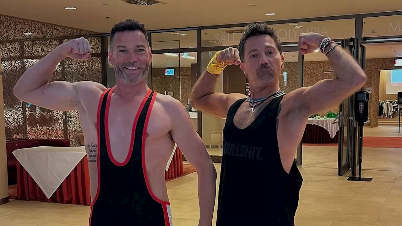 Gino D'Acampo flexes his biceps with Fred Sirieix while promoting their show Emission Impossible...