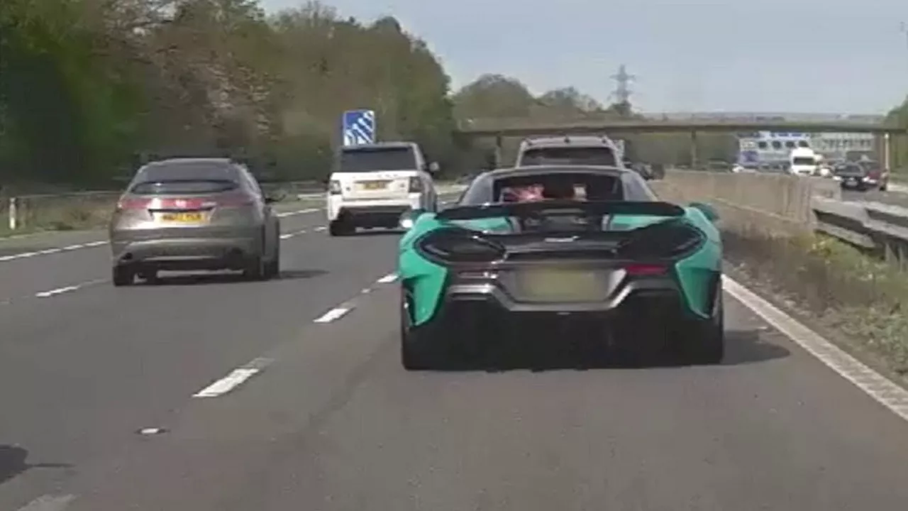 Moment 'reckless' driver is clocked speeding at 130mph down motorway in his £150,000 McLaren...