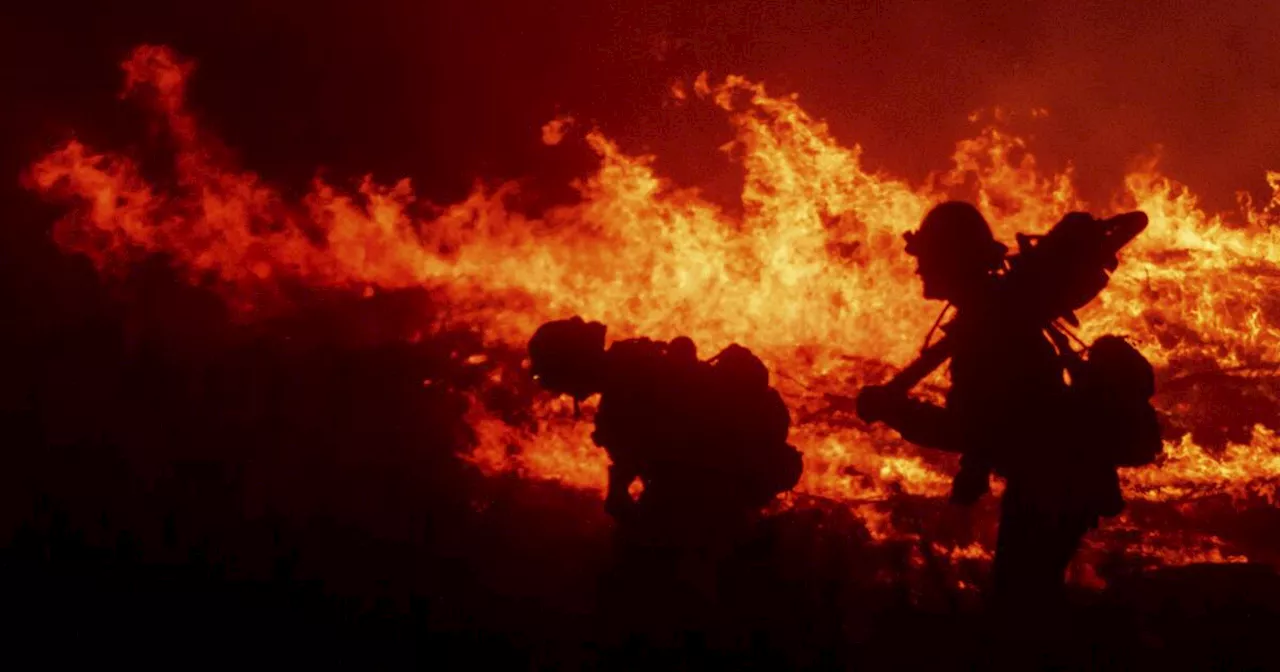 Fanned by gusting winds, the Franklin fire burns a destructive path through Malibu