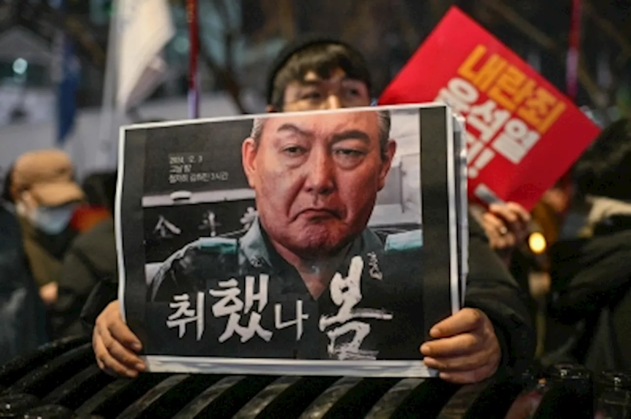 South Korean police raid president’s office amid martial law investigation