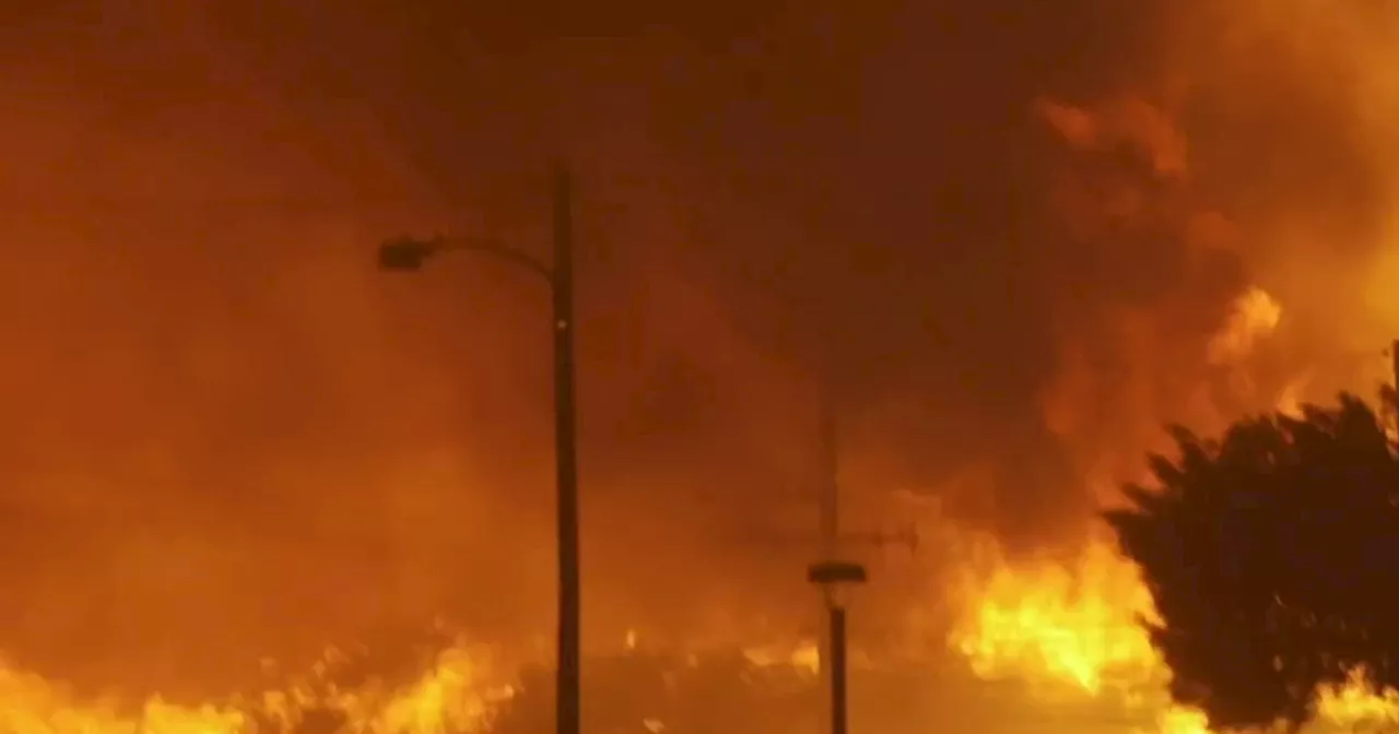 Fire blows up in Southern California, destroying homes and forcing thousands to evacuate