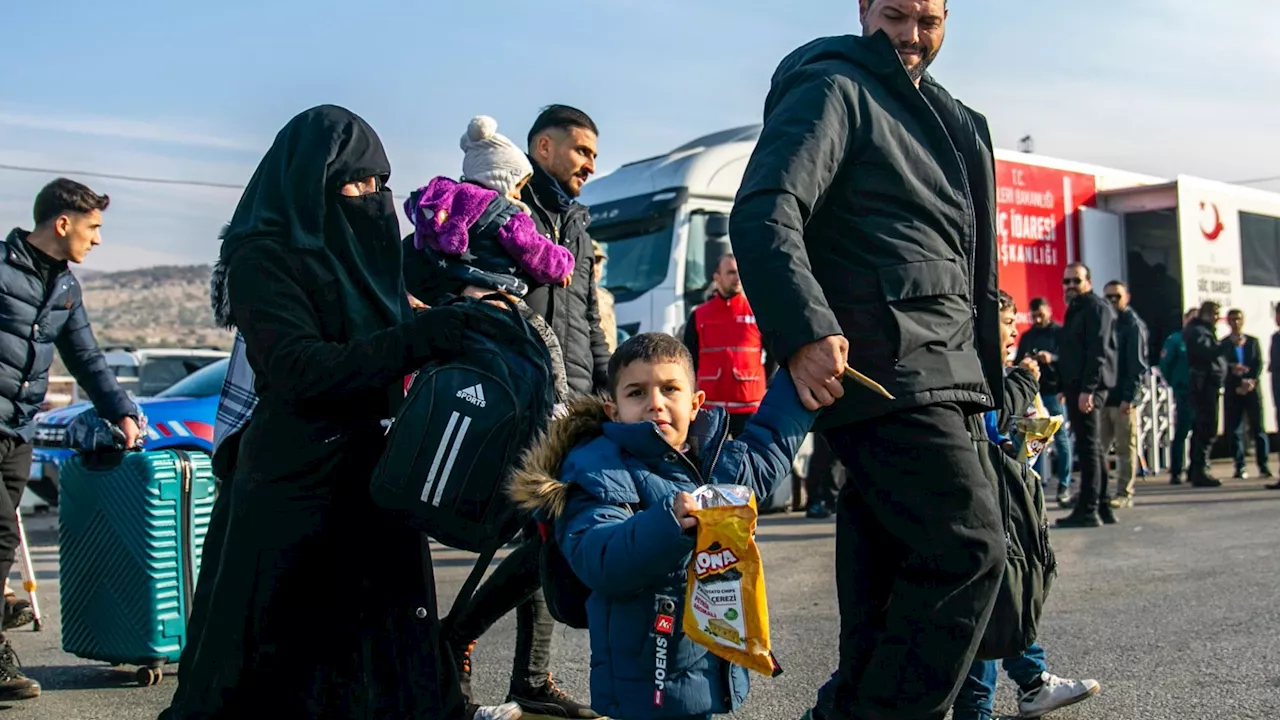 Thousands of Syrian refugees return home after brutal dictator Bashar al-Assad toppled by rebels...