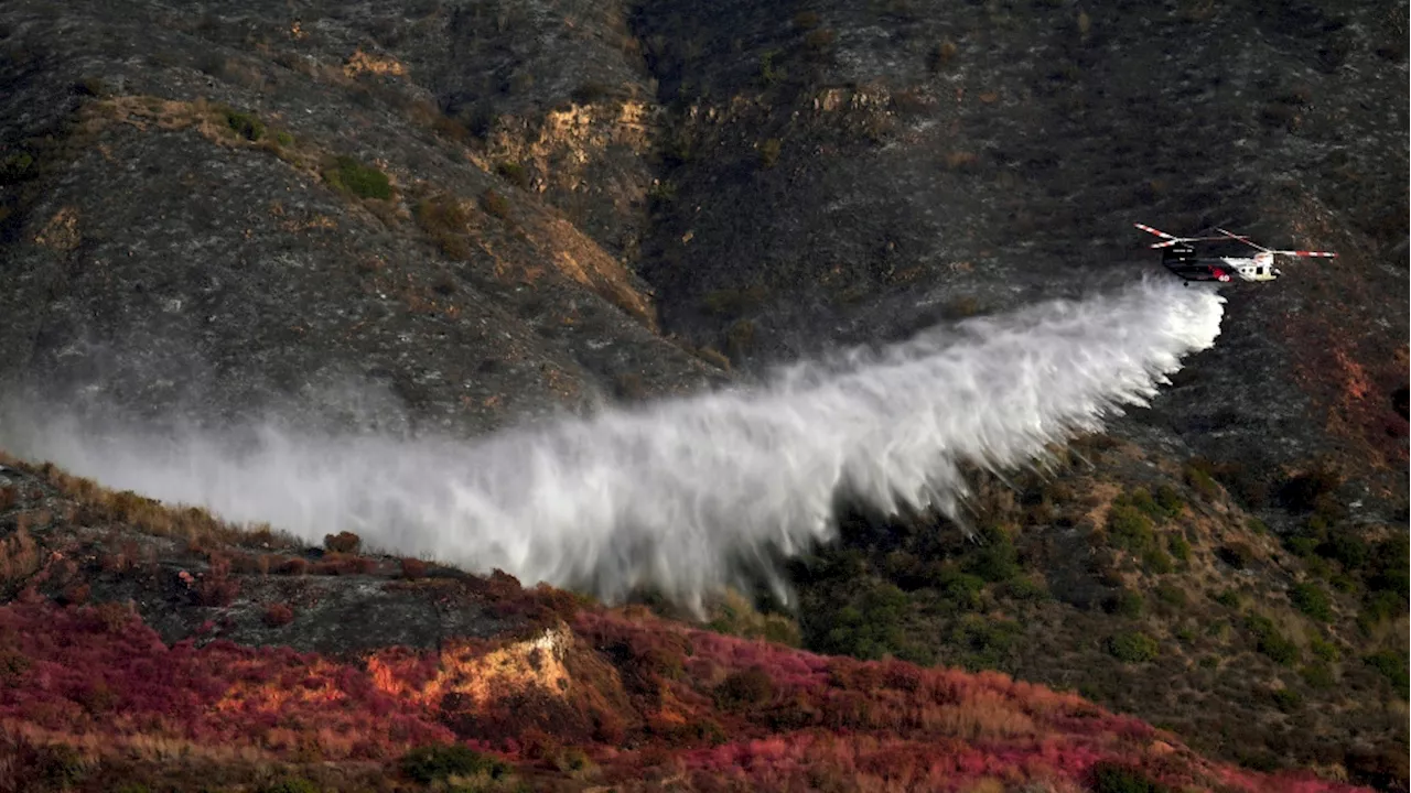 3,700 people return to Malibu homes as weather conditions improve and help firefighters battle blaze