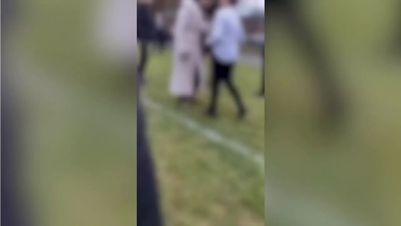 Police looking into 'disturbance' caught on camera at high school