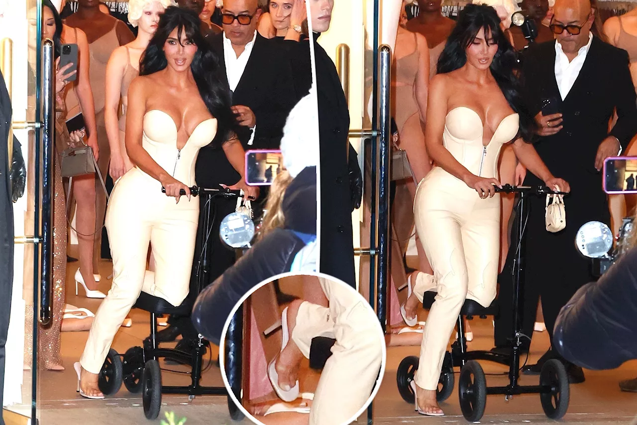 Kim Kardashian scoots her way into Skims event in sky-high heels despite broken foot