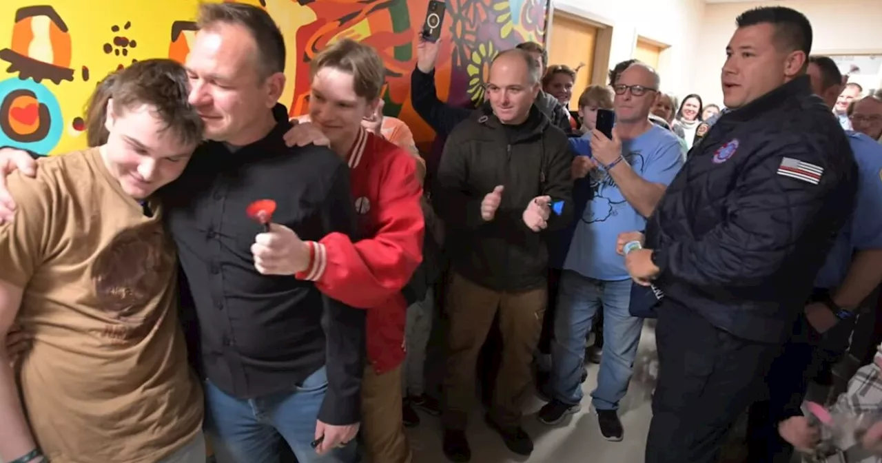 Firefighters surprise cancer patient at Riley Hospital during bell ringing ceremony