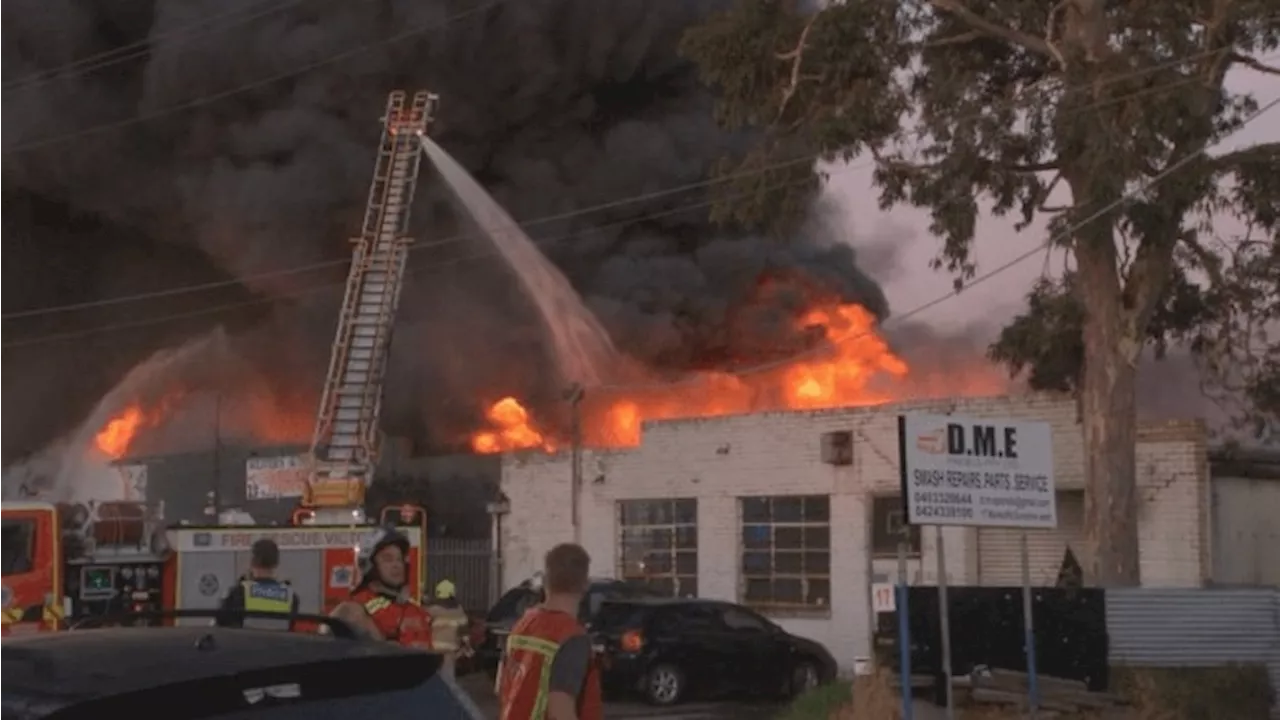 Man taken to hospital following large fire at repair shop near Melbourne