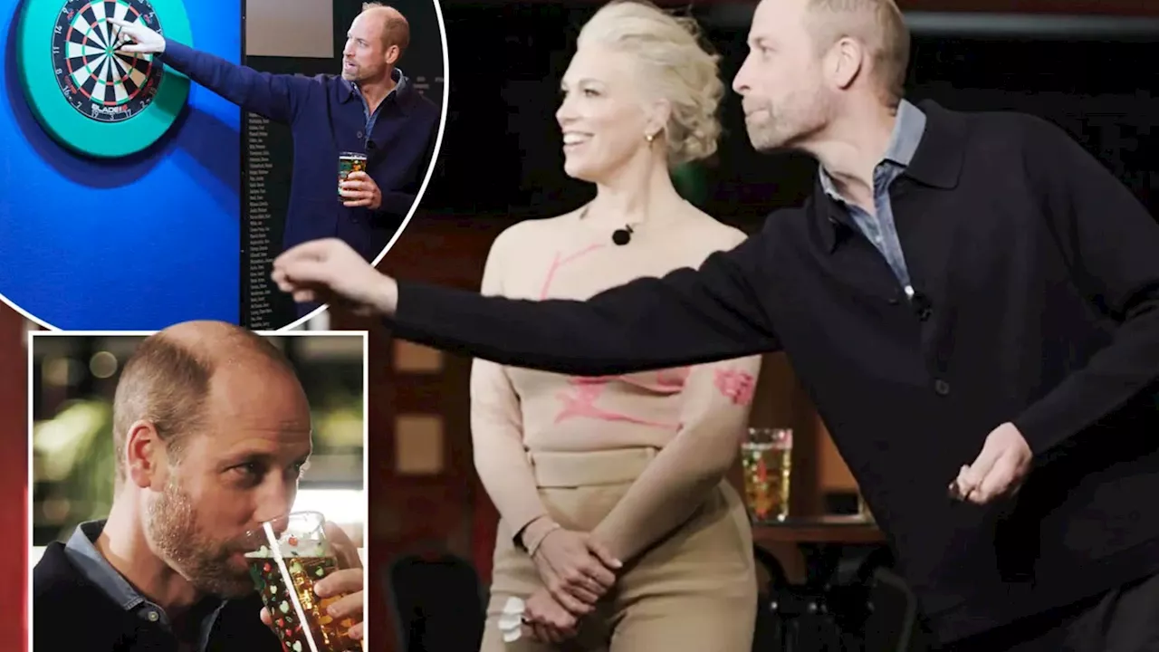 Prince William sips cider and enjoys a game of darts with actress Hannah Waddingham...