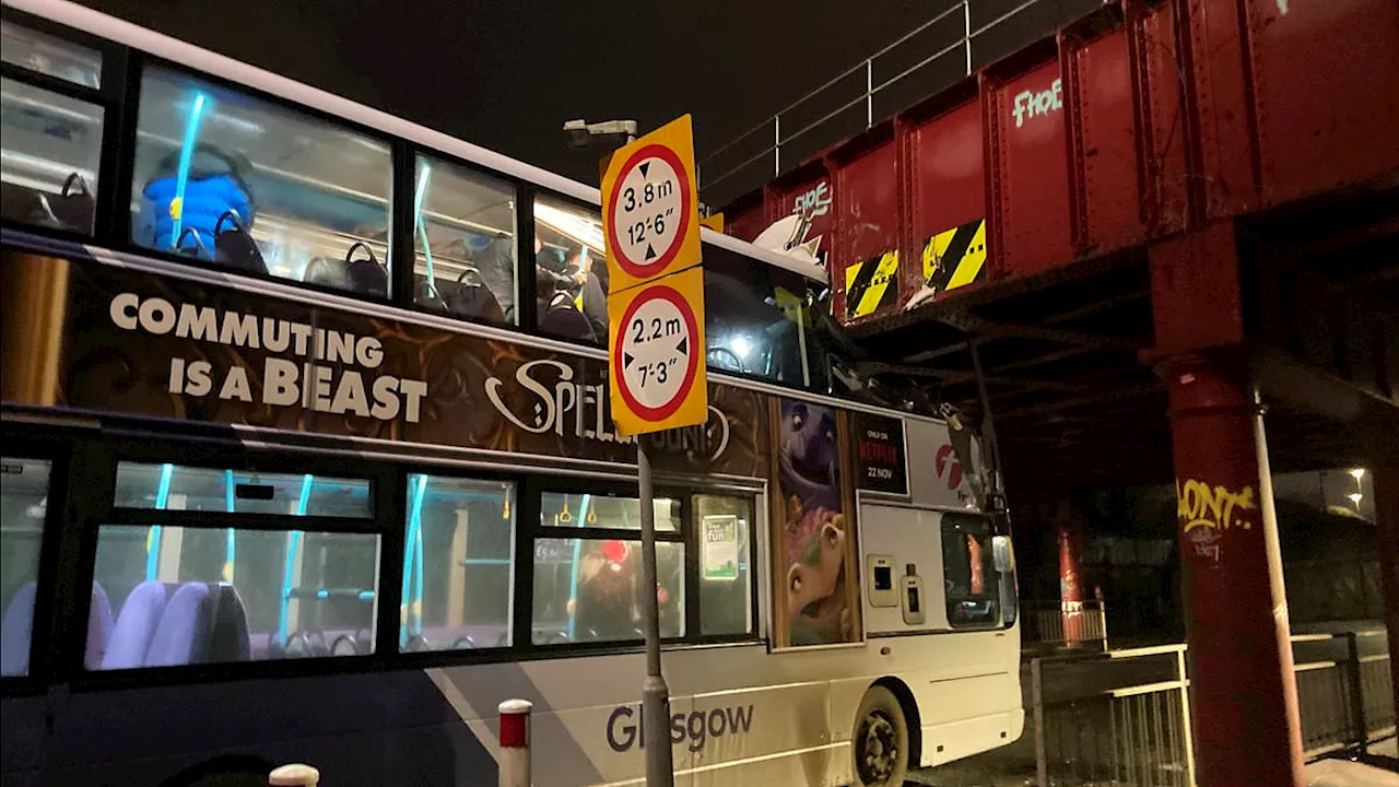 At least eight people are injured after double-decker bus crashes into Glasgow railway bridge -...