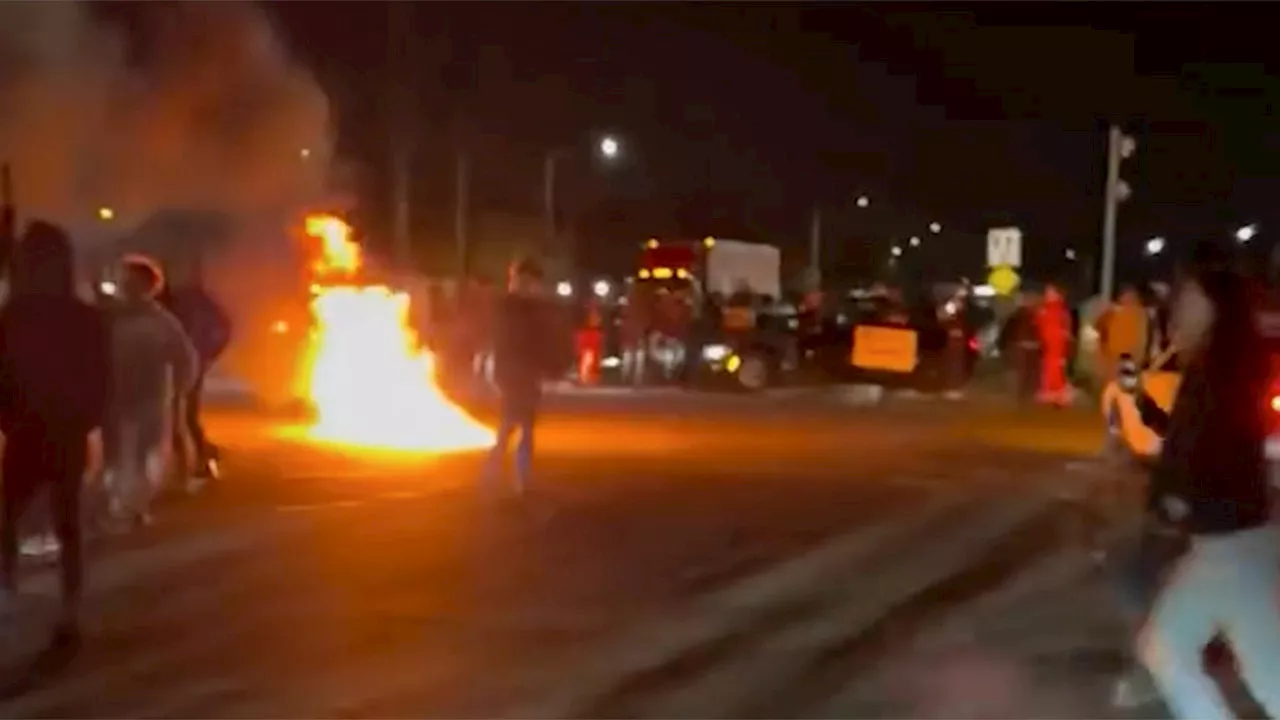 Fiery chaos at Florida intersection has sheriff's office searching for dozens of suspects