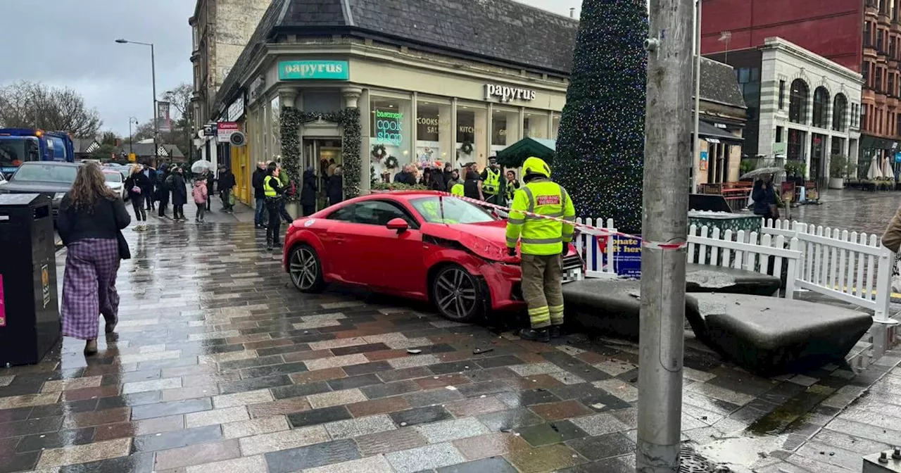 Car crashes onto pavement on busy Glasgow west end shopping street