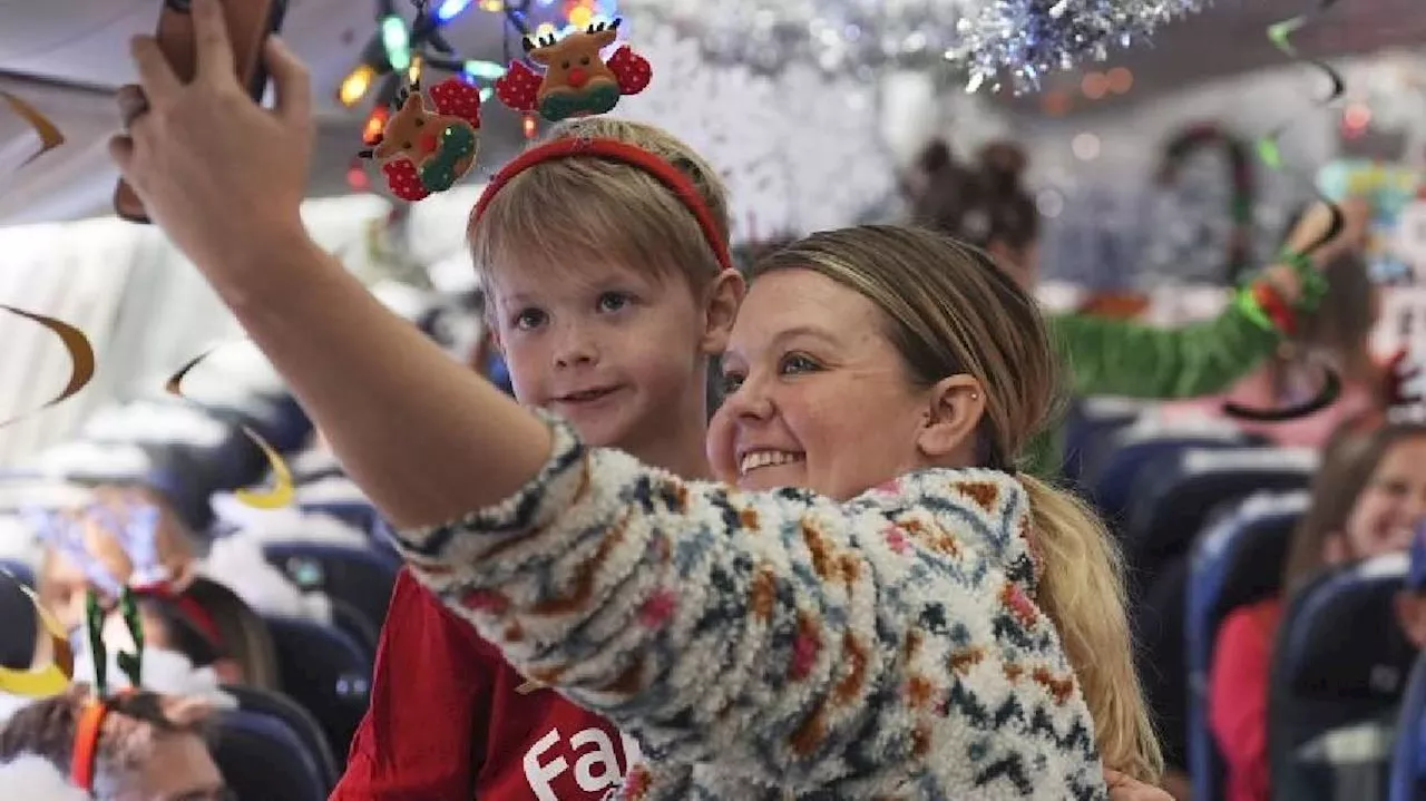 Flight takes kids to visit Santa at North Pole scene in transformed Denver airport hangar