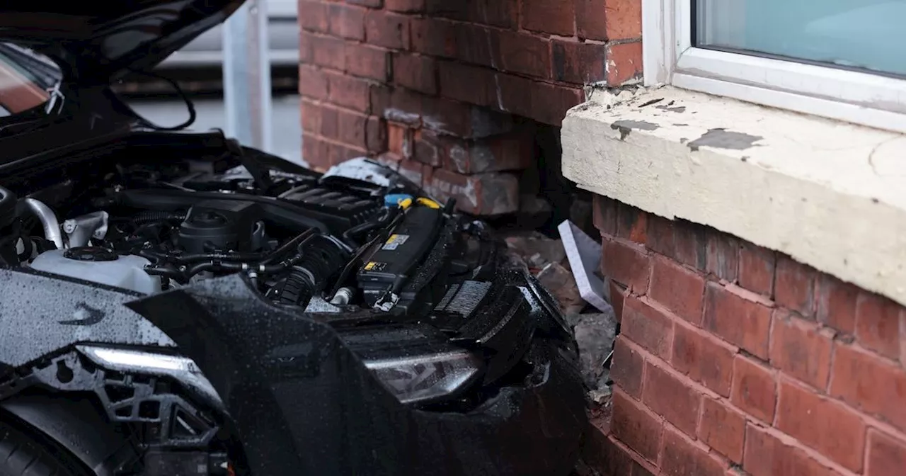 Car smashes into house in Stockport leaving massive hole