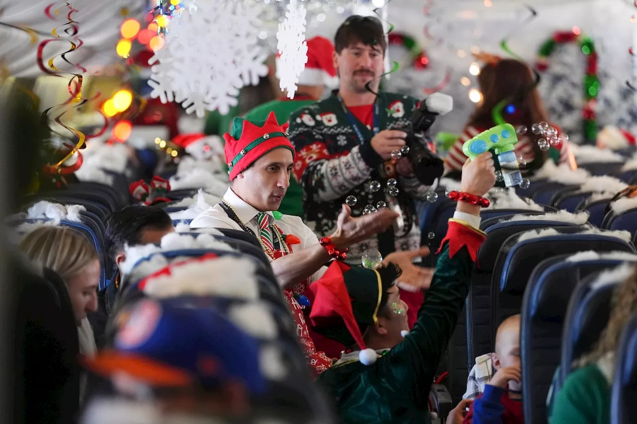 Flight takes kids to visit Santa at North Pole scene in transformed airport hangar