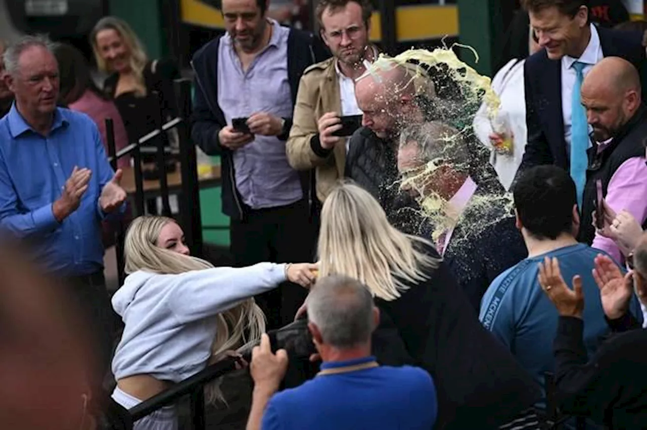 Woman who threw milkshake at Farage avoids jail sentence