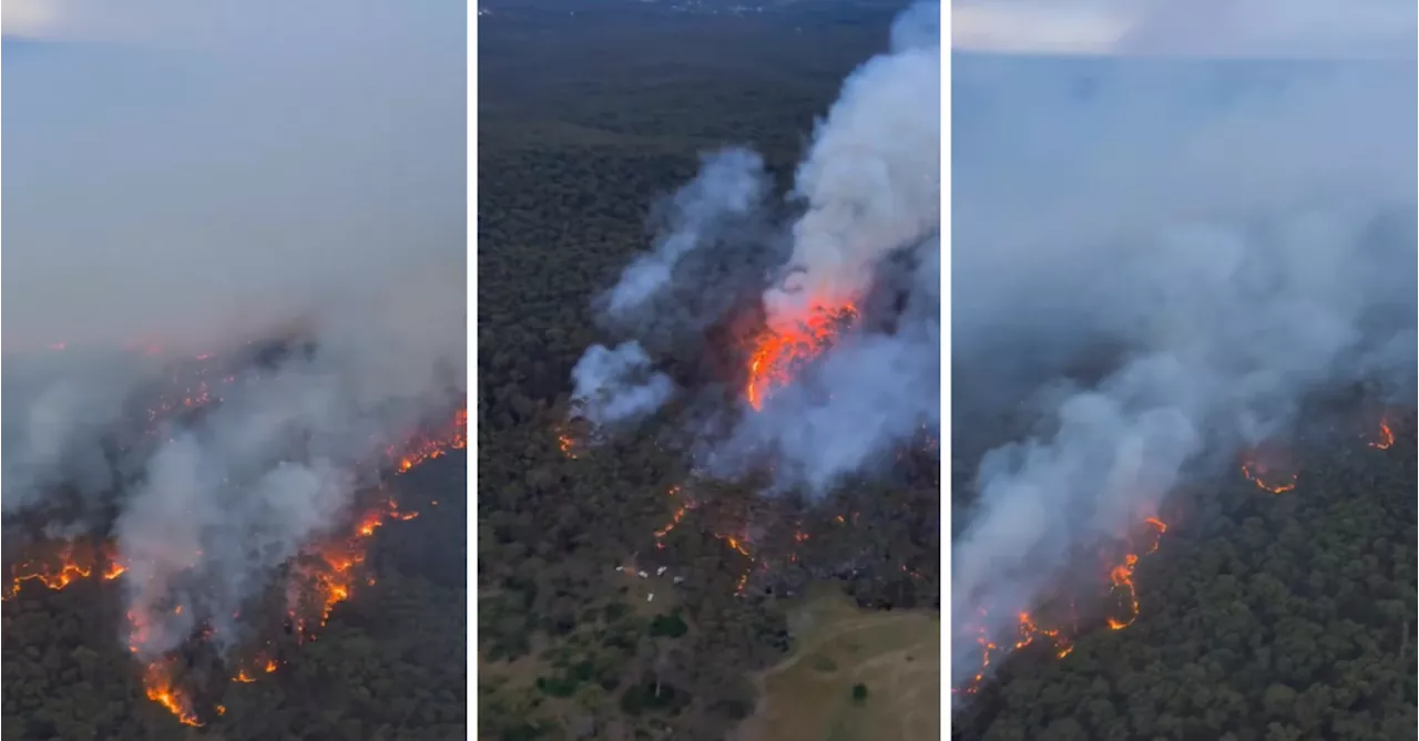 Emergency level bushfire downgraded as cool change sweeps across Victoria