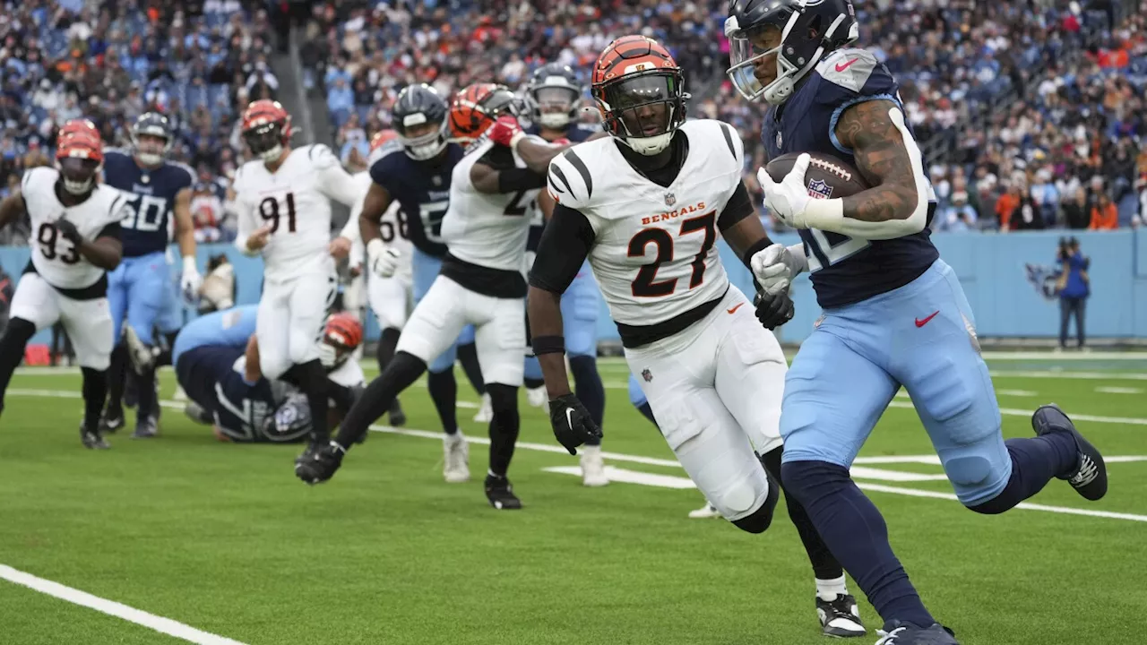 Cincinnati's Jordan Battle and Indy's Jonathan Taylor drop ball before goal line, negating TDs