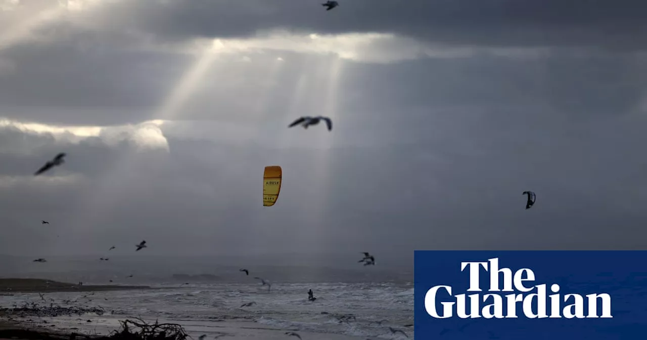 A surfing Santa and kite surfers in Scotland: photos of the day