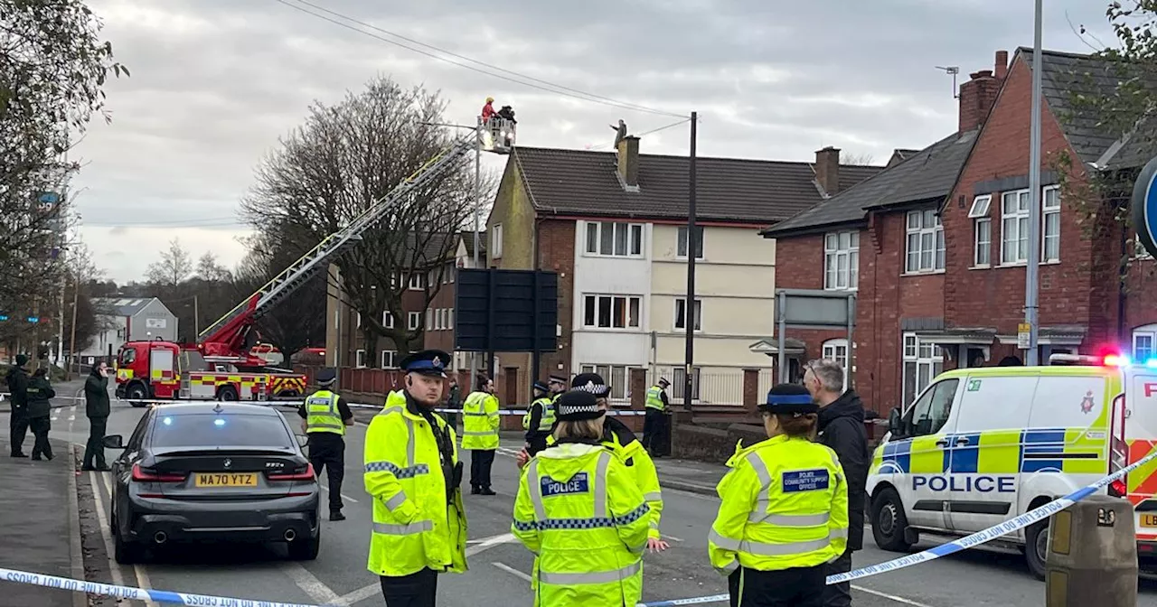 LIVE updates: Rooftop standoff as police surround block of flats in Bolton