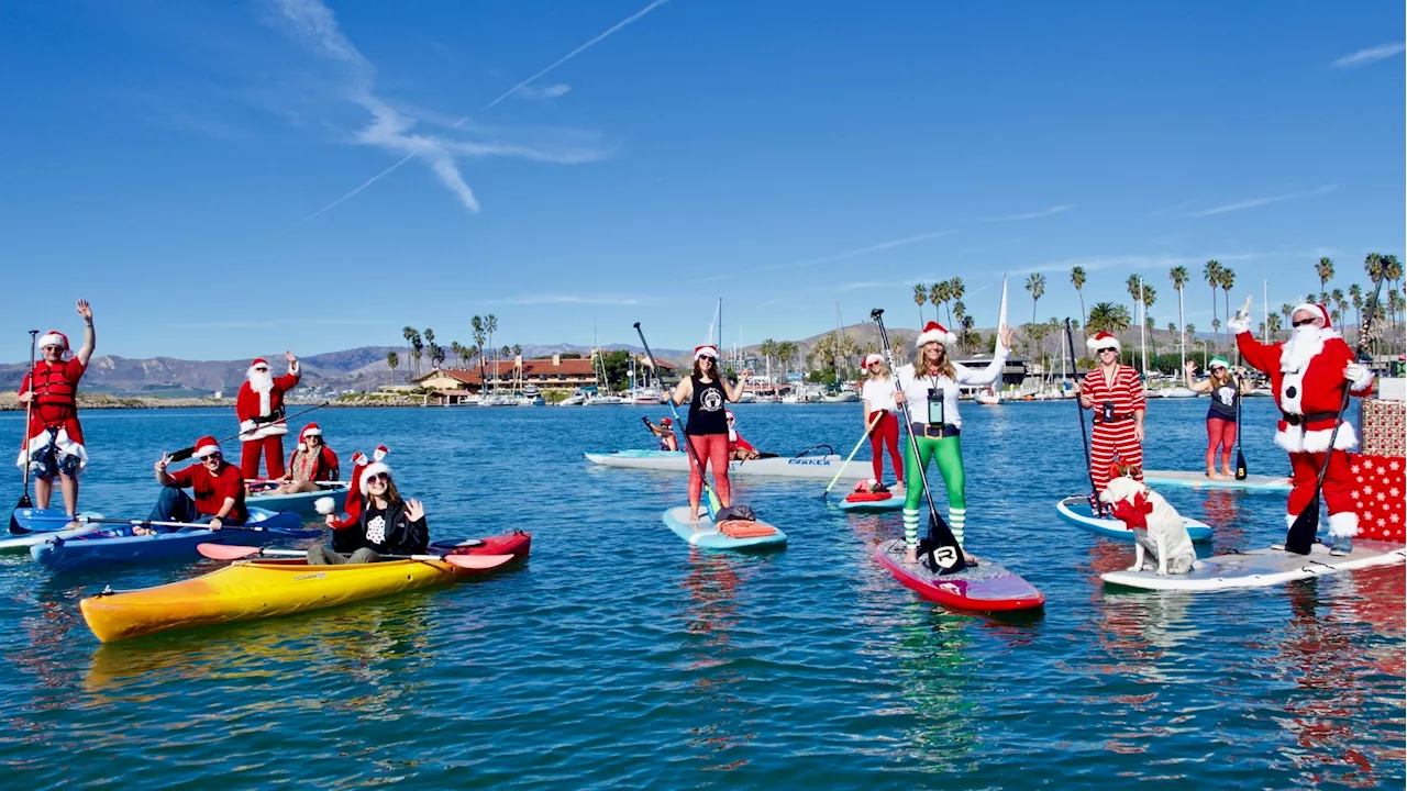 Elves go aquatic as the ‘Santa Paddle' cruises around Ventura Harbor