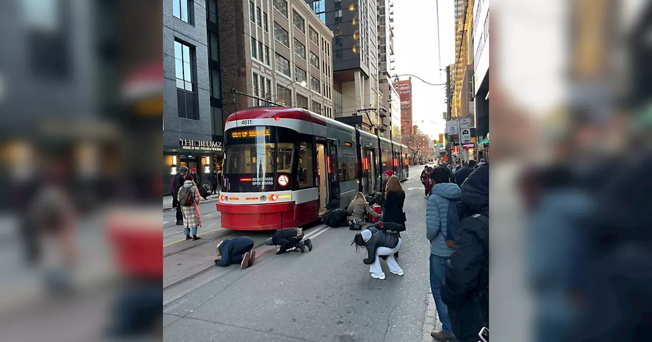 TTC passengers heroically band together to save cat trapped under streetcar