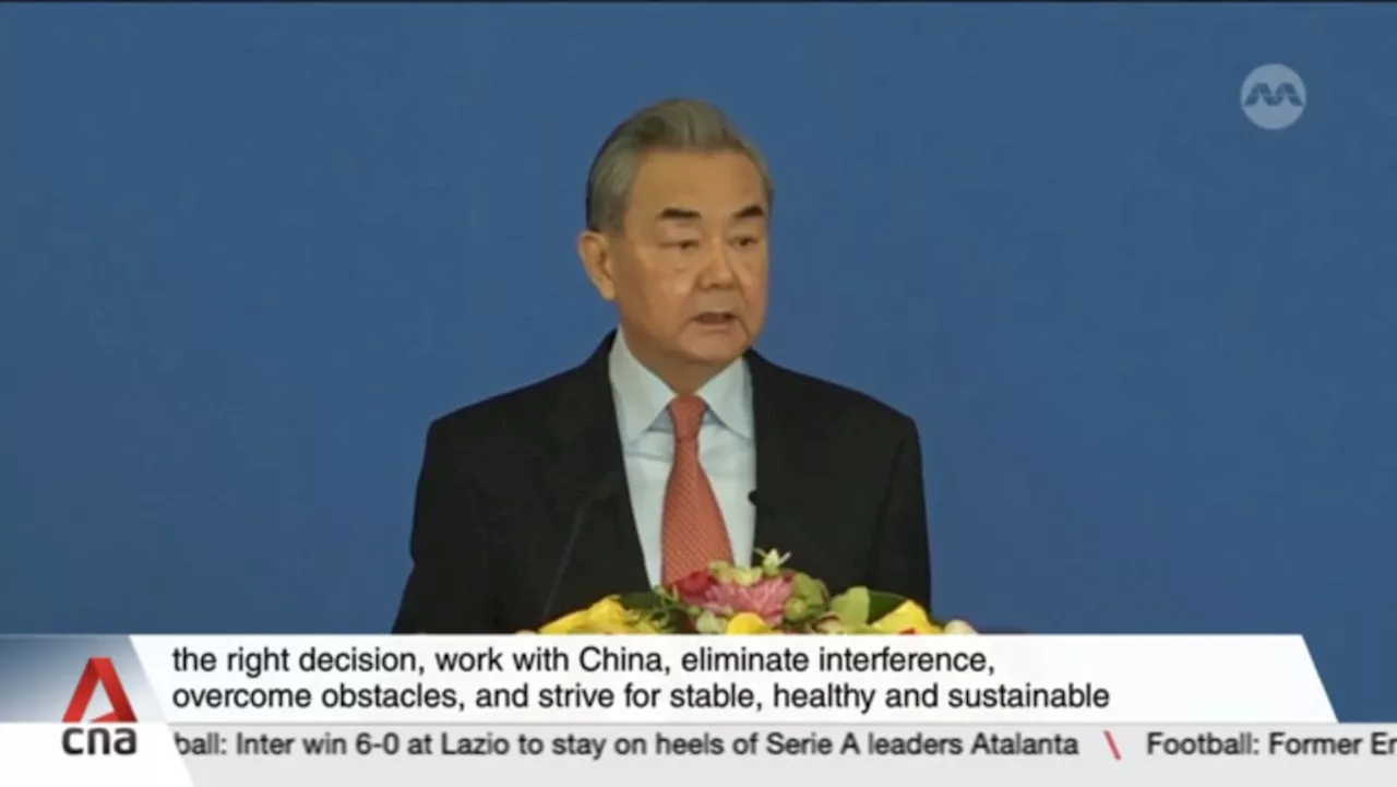 Chinese FM Wang Yi hopes Trump administration will 'make the right choices' and work with Beijing