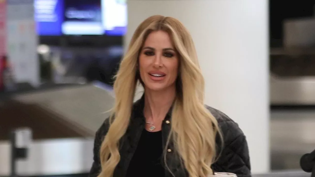 Kim Zolciak bares her tummy at airport in first sighting since police were called on her and Kroy...