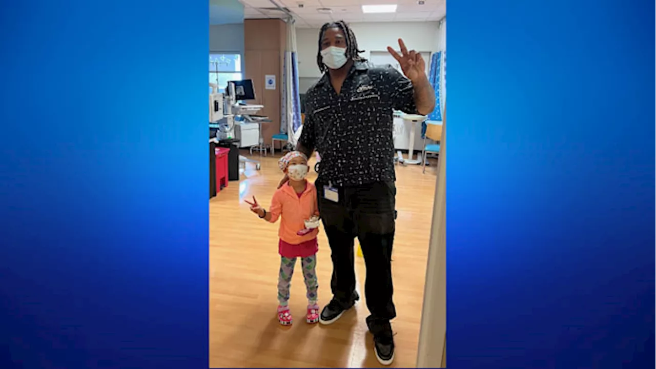 ‘All we can do is be there for them’ Texans’ Tim Settle Jr. surprises kids at M.D. Anderson with presents, spreads cheer