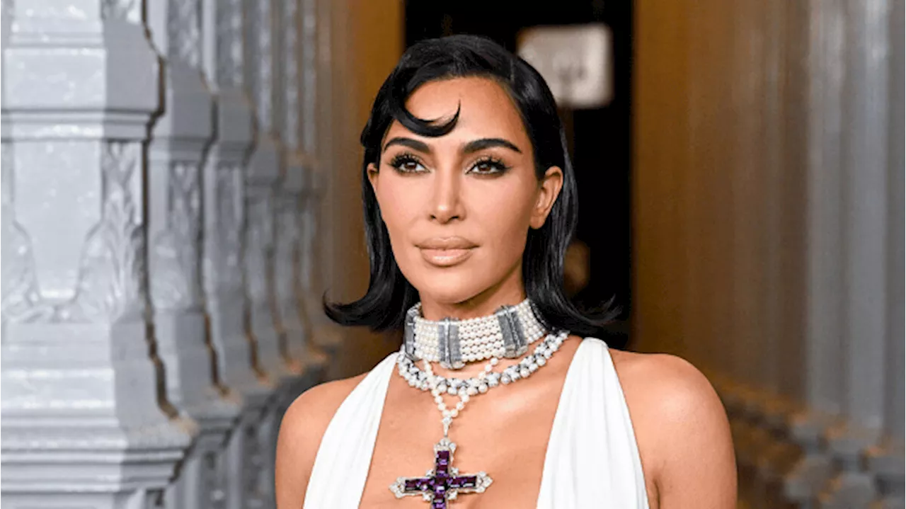 Kim Kardashian Debuts Bleached Brows in a Faux Fur Thong