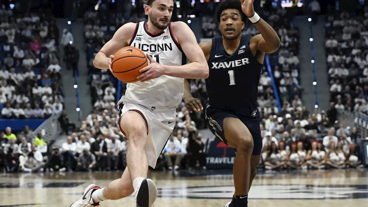 Karaban, Reed lead No. 11 UConn past Xavier 94-89 in overtime in its Big East opener